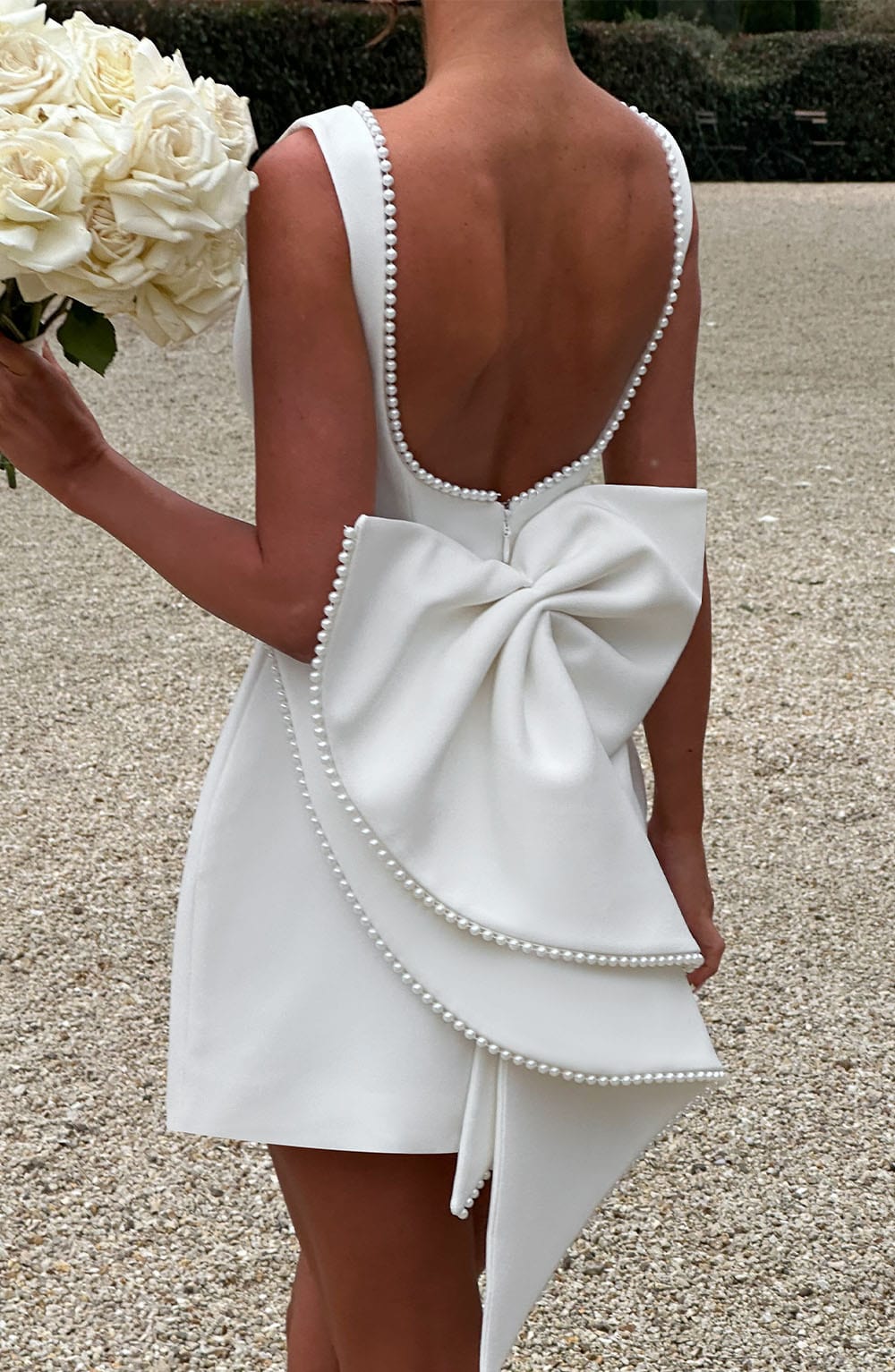 Elegant Pearl Trim Bow Mini Dress for Women with Boat Neck Sleeveless Fit and Flare Cocktail Style