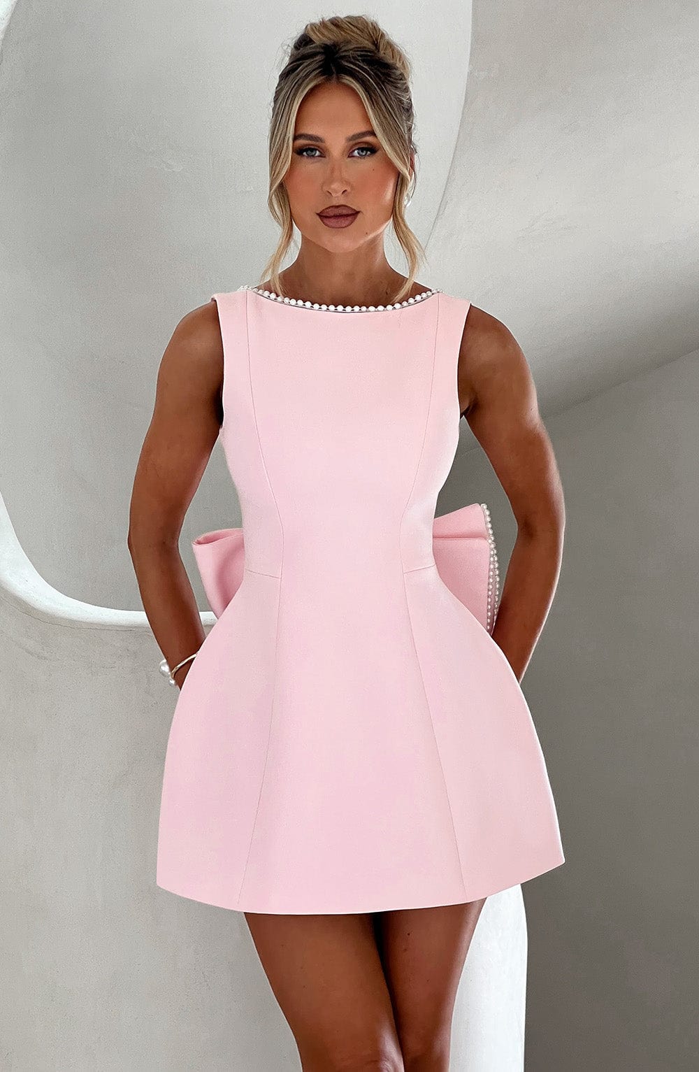 Elegant Pearl Trim Bow Mini Dress for Women with Boat Neck Sleeveless Fit and Flare Cocktail Style