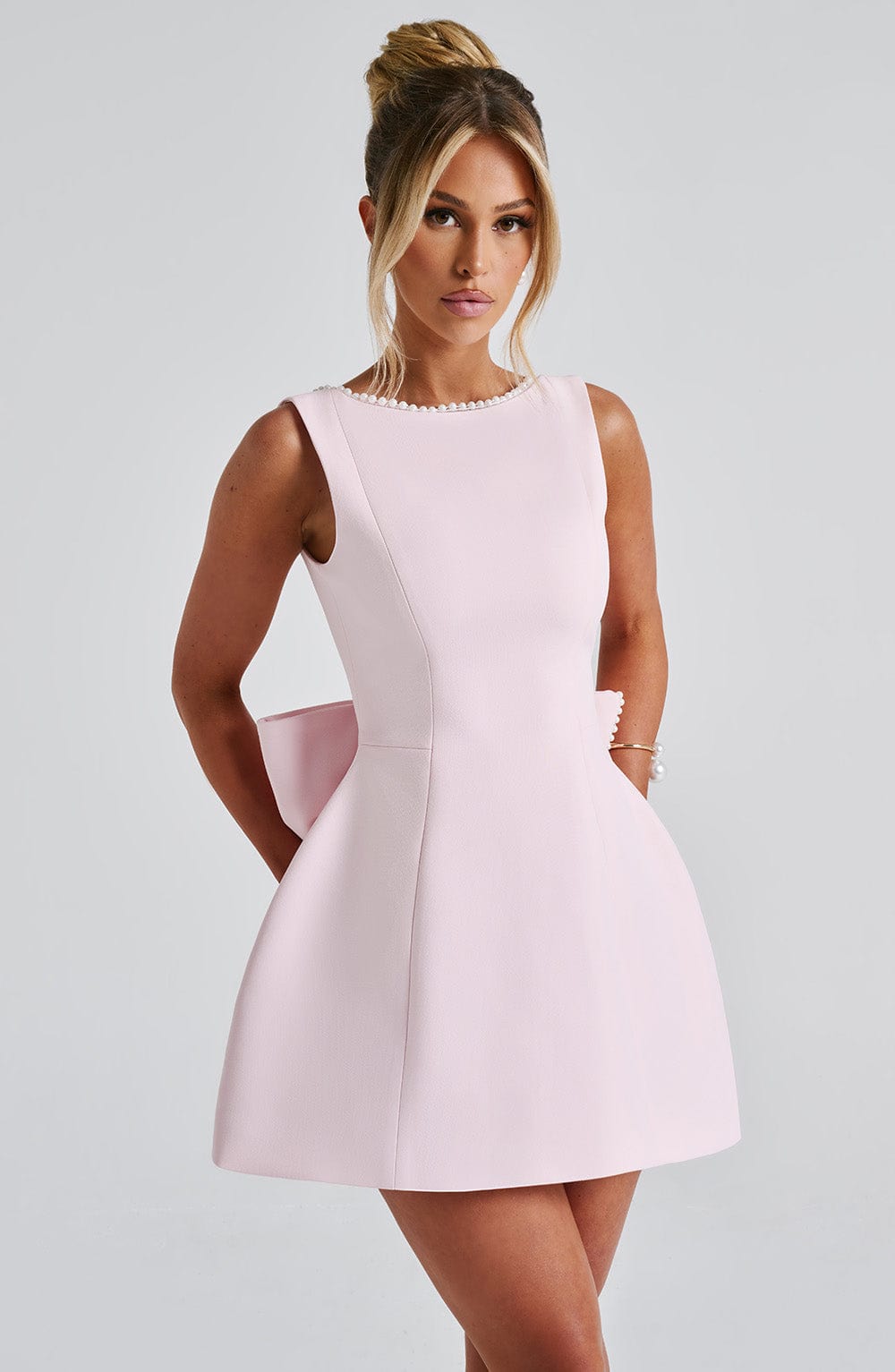 Elegant Pearl Trim Bow Mini Dress for Women with Boat Neck Sleeveless Fit and Flare Cocktail Style