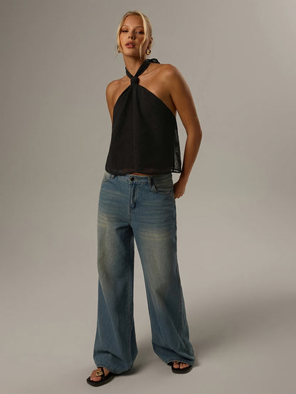 Effortless Black Swiss Dot Blouse for Women with Halter Neck Backless Bow Tie Flowing Tank Style