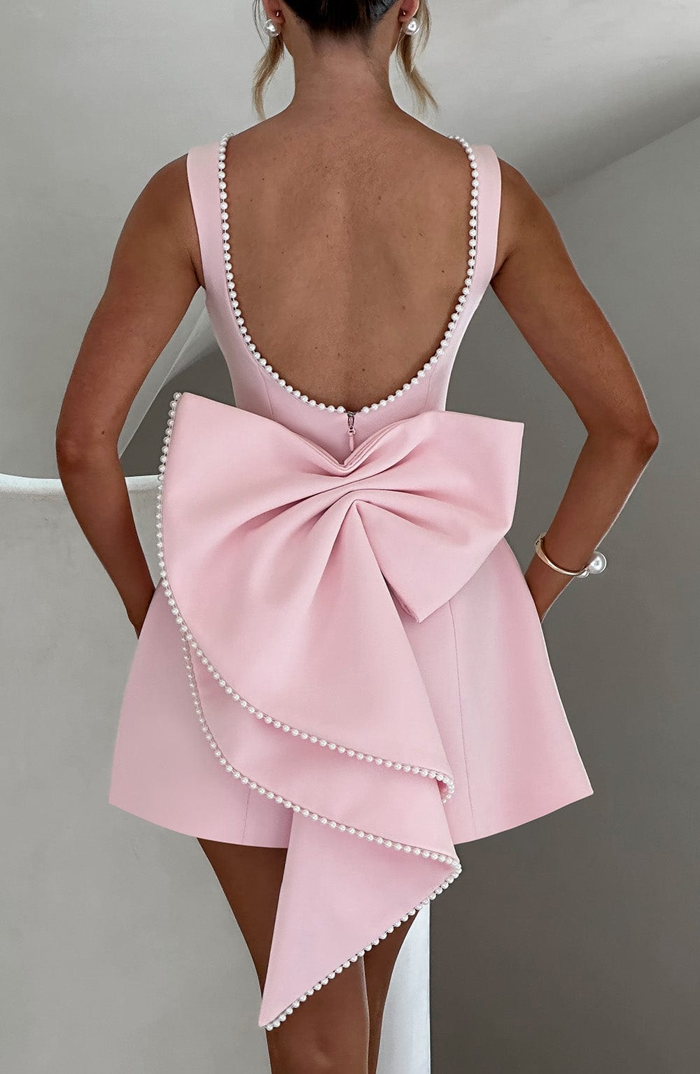 Elegant Pearl Trim Bow Mini Dress for Women with Boat Neck Sleeveless Fit and Flare Cocktail Style