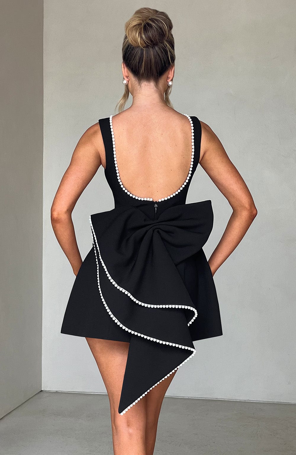 Elegant Pearl Trim Bow Mini Dress for Women with Boat Neck Sleeveless Fit and Flare Cocktail Style
