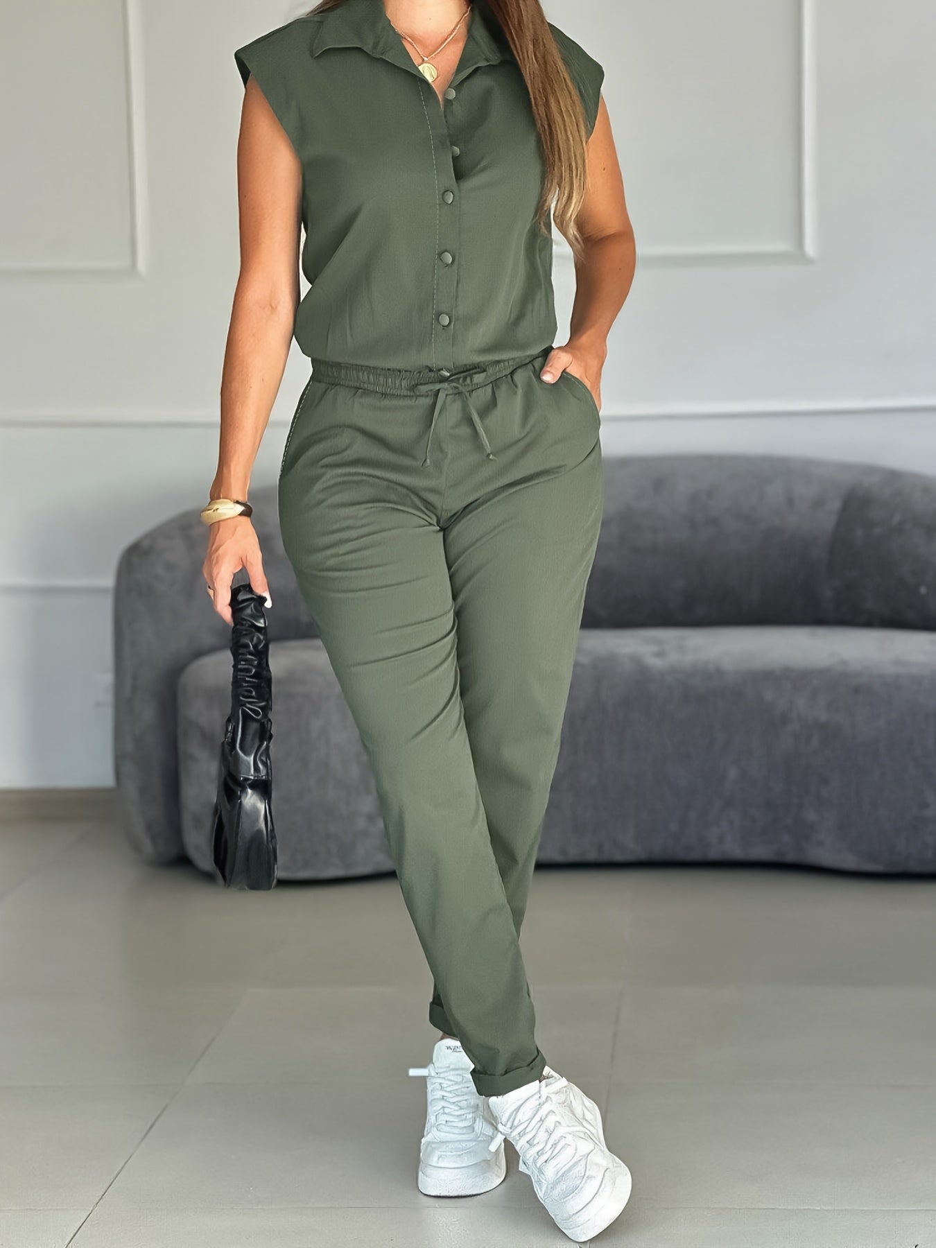 The Jumpsuit Features a Loose-Fitting Design with an Adjustable Waist