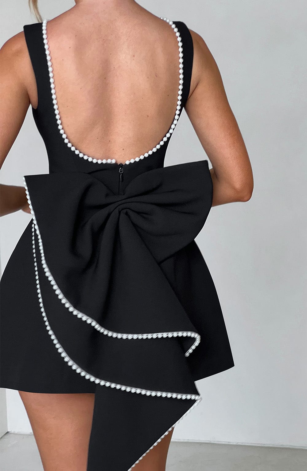 Elegant Pearl Trim Bow Mini Dress for Women with Boat Neck Sleeveless Fit and Flare Cocktail Style