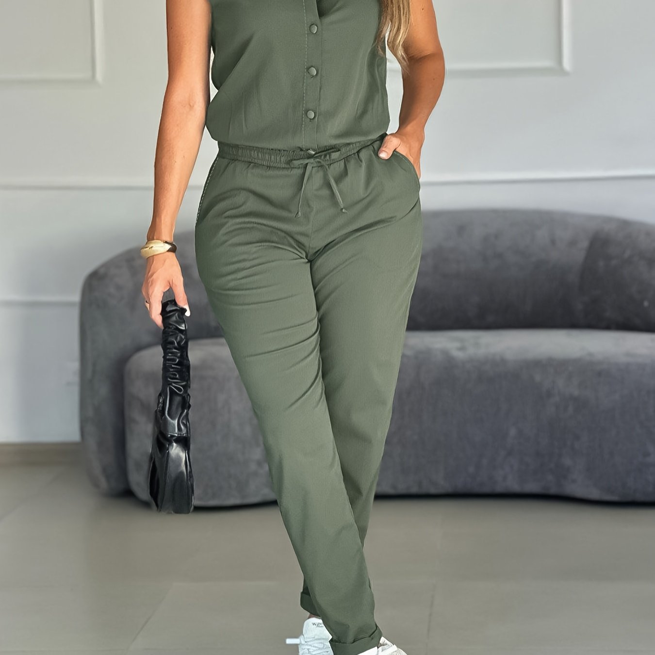 The Jumpsuit Features a Loose-Fitting Design with an Adjustable Waist